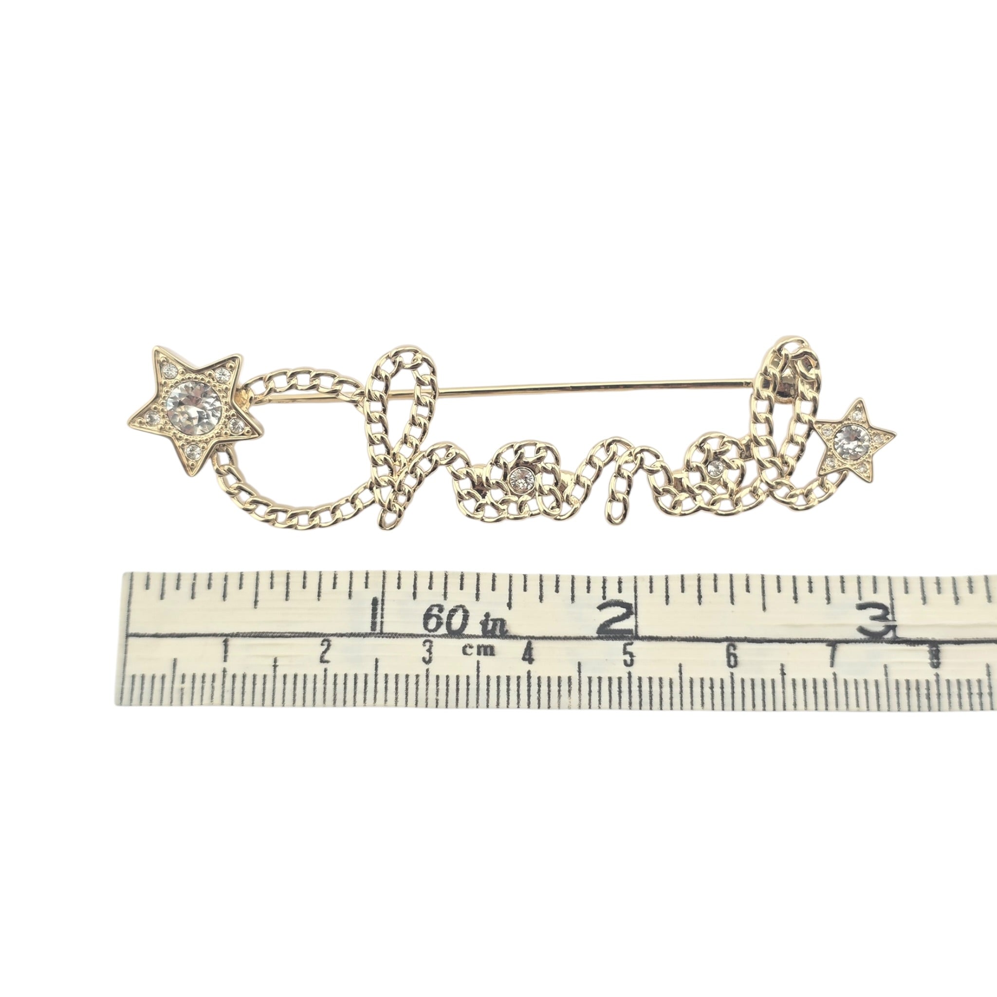 Chanel Letters Gold Crystal Brooch 2025 CHANEL