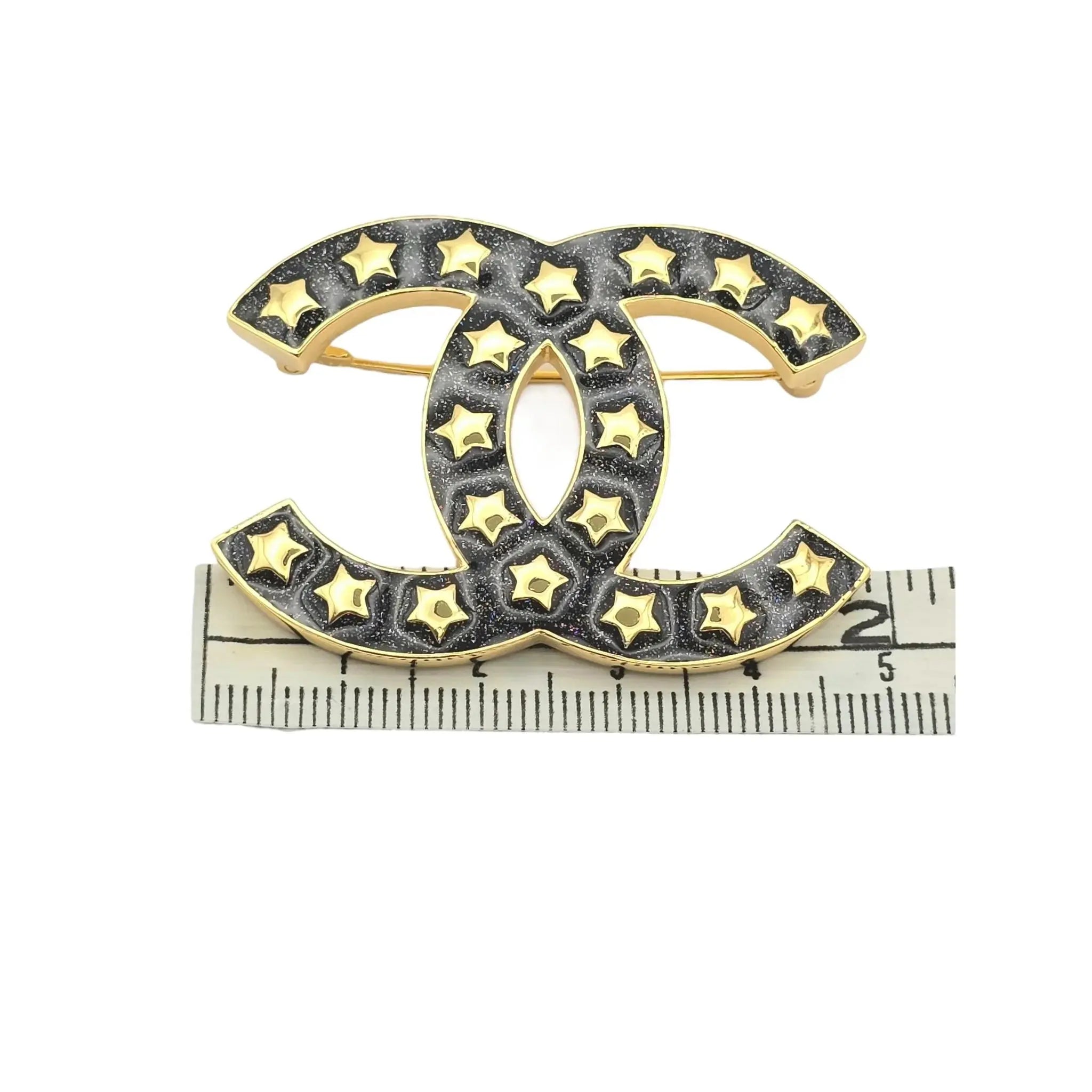 Chanel Metal Resin CC Star Logo Brooch Gold Black 2024 CHANEL